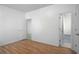 This bedroom features wood floors and an attached bathroom at 6439 Grey Fox Way, Riverdale, GA 30296