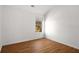 This room has a vaulted ceiling, hardwood floors and a large window at 6439 Grey Fox Way, Riverdale, GA 30296