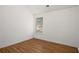 This room features a window, hardwood floors, white walls, and modern finishes at 6439 Grey Fox Way, Riverdale, GA 30296