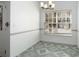 Bright dining area featuring tile floor, ample natural light, and modern chandelier at 6439 Grey Fox Way, Riverdale, GA 30296