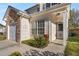 Inviting front porch with decorative touches and a well-kept lawn leading to the entrance at 6439 Grey Fox Way, Riverdale, GA 30296