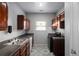 Functional kitchen featuring wooden cabinets, modern appliances, and natural light at 6439 Grey Fox Way, Riverdale, GA 30296