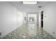 Spacious living room showcasing tile flooring, and connections to the kitchen and entry at 6439 Grey Fox Way, Riverdale, GA 30296