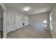 Neutral bedroom with multiple closets, ample natural light, and neutral carpet at 7021 Hillcrest Chase Ln, Austell, GA 30168