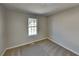 Bedroom showcasing a window for natural light and carpet at 7021 Hillcrest Chase Ln, Austell, GA 30168