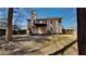 Home exterior featuring a deck, neutral siding, well-maintained backyard and mature trees at 7021 Hillcrest Chase Ln, Austell, GA 30168