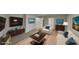 Stylishly staged living room with modern furniture, decor, and a large television at 7021 Hillcrest Chase Ln, Austell, GA 30168
