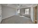 Spacious main bedroom with a tray ceiling and two windows providing ample natural light at 7021 Hillcrest Chase Ln, Austell, GA 30168