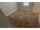 Bedroom featuring a window, neutral walls and stained carpet at 1815 Boulderview Se Dr, Atlanta, GA 30316