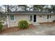 Brick exterior featuring shrubs and a black front door at 1815 Boulderview Se Dr, Atlanta, GA 30316