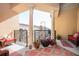 Outdoor balcony with ample seating, columns, and potted plants at 200 River Vista Dr # 736, Atlanta, GA 30339