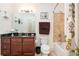 Bathroom featuring a vanity with granite countertops, sink, toilet, and tiled tub with shower at 200 River Vista Dr # 736, Atlanta, GA 30339