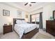 Bright bedroom featuring large window, ceiling fan, carpet, and neutral paint at 200 River Vista Dr # 736, Atlanta, GA 30339