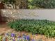 Elegant 'One River Place' community sign surrounded by lush landscaping and vibrant flowers at 200 River Vista Dr # 736, Atlanta, GA 30339