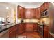 Well-equipped kitchen featuring stainless steel appliances and dark cabinets with granite countertops at 200 River Vista Dr # 736, Atlanta, GA 30339