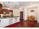 Updated kitchen with stainless appliances and a breakfast bar, plus a dining area with a wooden table at 200 River Vista Dr # 736, Atlanta, GA 30339