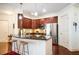Modern kitchen with stainless steel appliances, breakfast bar, and dark wood cabinets at 200 River Vista Dr # 736, Atlanta, GA 30339