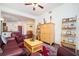 Cozy living room with hardwood floors, ceiling fan, and an open view into the kitchen at 200 River Vista Dr # 736, Atlanta, GA 30339