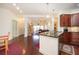 Inviting living room with hardwood floors seamlessly connected to the kitchen, providing an open and airy atmosphere at 200 River Vista Dr # 736, Atlanta, GA 30339