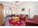 Bright living room featuring a comfortable seating area, a ceiling fan, and a sliding door to the outside balcony at 200 River Vista Dr # 736, Atlanta, GA 30339