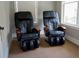 Relax and unwind in your own home with these luxurious massage chairs by the window at 200 River Vista Dr # 736, Atlanta, GA 30339
