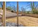 Large backyard with a retaining wall and privacy fence at 375 Chattahoochee St, Roswell, GA 30075