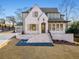 Front exterior of a brick home with lush lawn at 375 Chattahoochee St, Roswell, GA 30075