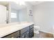 Bathroom featuring single vanity and dark cabinets with tile flooring at 47 Greatwood Dr, White, GA 30184