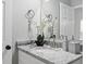 Cozy bathroom featuring a granite countertop, brushed nickel fixtures and decorative accents at 1190 Dallas Hwy, Villa Rica, GA 30180