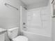 Clean bathroom featuring a shower-tub combination and modern fixtures at 1190 Dallas Hwy, Villa Rica, GA 30180