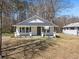 Charming one-story home with white siding, a covered porch, and a well-manicured front lawn at 1190 Dallas Hwy, Villa Rica, GA 30180