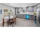 Eat-in kitchen area with gray cabinetry, modern appliances, and granite counter tops at 1190 Dallas Hwy, Villa Rica, GA 30180