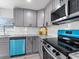 Close up on stylish gray cabinets and modern stainless steel appliances at 1190 Dallas Hwy, Villa Rica, GA 30180