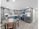 Updated kitchen features gray cabinets, stainless appliances, and a breakfast nook at 1190 Dallas Hwy, Villa Rica, GA 30180