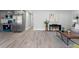 Open-concept layout featuring a gray kitchen, dining area, and living space with wood floors, complemented by modern finishes at 1190 Dallas Hwy, Villa Rica, GA 30180