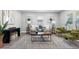 Bright living area showcasing stylish furnishings, a gray rug, and natural light, with windows providing a relaxing ambiance at 1190 Dallas Hwy, Villa Rica, GA 30180