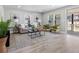 A sunny living room featuring neutral tones, wood-look floors, modern decor, and ample natural light for a cozy atmosphere at 1190 Dallas Hwy, Villa Rica, GA 30180