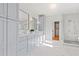 Spa-like bathroom with double vanity, gray cabinets, soaking tub, walk-in shower, and marble floors at 2849 Parkridge Ne Dr, Brookhaven, GA 30319