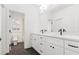 Modern bathroom with double vanity, marble countertop, and sleek fixtures at 2849 Parkridge Ne Dr, Brookhaven, GA 30319