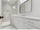 Modern bathroom with walk-in shower, sleek vanity, and tiled floor at 2849 Parkridge Ne Dr, Brookhaven, GA 30319