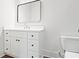 Bathroom features a sleek white vanity with drawers and cabinets, complemented by a stylish rectangular mirror at 2849 Parkridge Ne Dr, Brookhaven, GA 30319