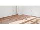 Spacious bedroom featuring sleek wood floors and multiple doorways for easy access and flow at 2849 Parkridge Ne Dr, Brookhaven, GA 30319