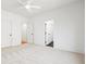 Bright bedroom with white walls, carpet, and a modern ceiling fan, creating a serene atmosphere at 2849 Parkridge Ne Dr, Brookhaven, GA 30319