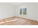 Bright bedroom with wood floors and a large window providing natural light and a view of the outdoors at 2849 Parkridge Ne Dr, Brookhaven, GA 30319