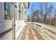 Side view of a wood deck with white railing and a view of trees at 2849 Parkridge Ne Dr, Brookhaven, GA 30319
