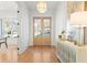 Stylish foyer with hardwood floors, elegant sideboard, and a view of the inviting front doors at 2849 Parkridge Ne Dr, Brookhaven, GA 30319