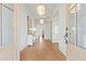 Bright foyer with hardwood floors, modern light fixtures, and elegant decor creating a welcoming entrance at 2849 Parkridge Ne Dr, Brookhaven, GA 30319