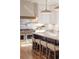 Modern kitchen with white cabinetry, stainless steel appliances, a center island, and hardwood floors at 2849 Parkridge Ne Dr, Brookhaven, GA 30319