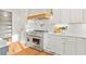 Modern kitchen with stainless steel appliances, white cabinetry, and hardwood floors throughout the space at 2849 Parkridge Ne Dr, Brookhaven, GA 30319