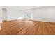 A bright and airy living room features beautiful wood flooring, modern lighting, and a glass door to the outside at 2849 Parkridge Ne Dr, Brookhaven, GA 30319
